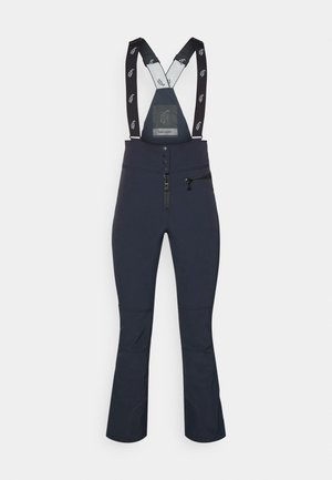 Calças de esqui azul marinho com suspensórios pretos ajustáveis, bolso com fecho, fecho de botão, design de pernas largas e tecido texturizado para calor.