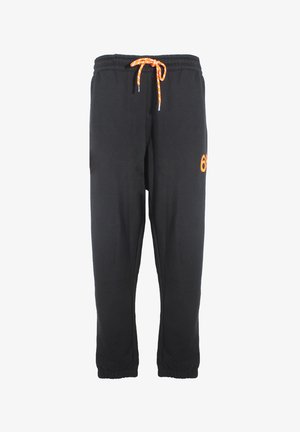 Pantaloni sportivi neri con vita elastica, coulisse arancione e dettagli del logo arancioni. Polsini alla caviglia. Tessuto di morbida consistenza.