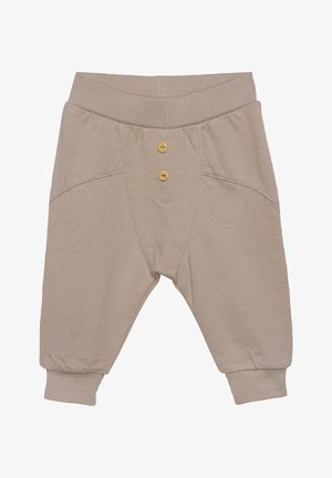 Beige katoenen peuterbroek met een ribgebreide tailleband, knoopaccenten, voorzakken en taps toelopende boorden. Zachte textuur, eenvoudig ontwerp.