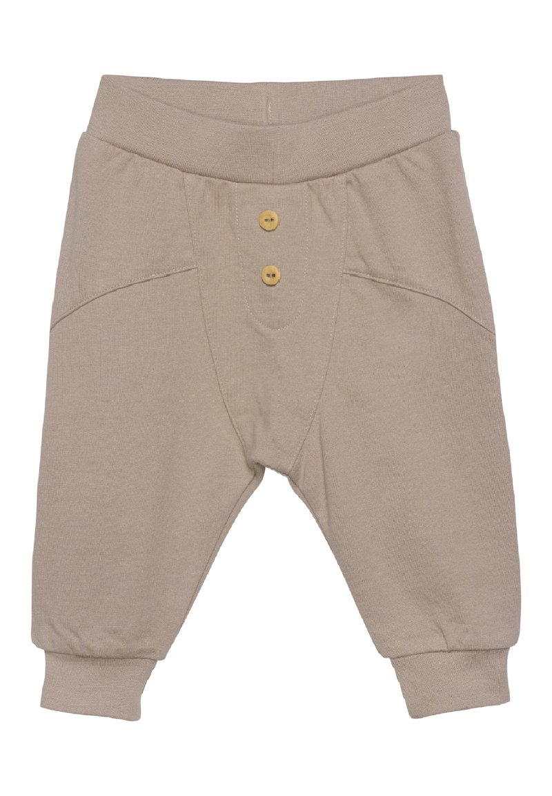 Beige katoenen peuterbroek met een ribgebreide tailleband, knoopaccenten, voorzakken en taps toelopende boorden. Zachte textuur, eenvoudig ontwerp.