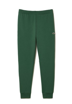 Dunkelgrüne schmal zulaufende Jogginghose mit elastischem Bund und kleinem Krokodil-Logo am oberen Oberschenkel, mit Bündchen an den Knöcheln.