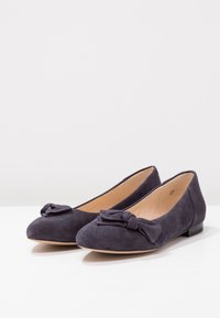 Dark gray suede women's ballet flats with rounded toes, low heels, and decorative knotted bows on top.