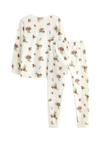 Ensemble de pyjama en coton comprenant un haut à manches longues et un pantalon. Fond blanc cassé avec un imprimé floral en rouge et vert. Ceinture élastique sur le pantalon.