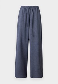 Pantalon large marine en tissu texturé avec taille élastique et cordon ajustable, présentant une coupe ample et décontractée.