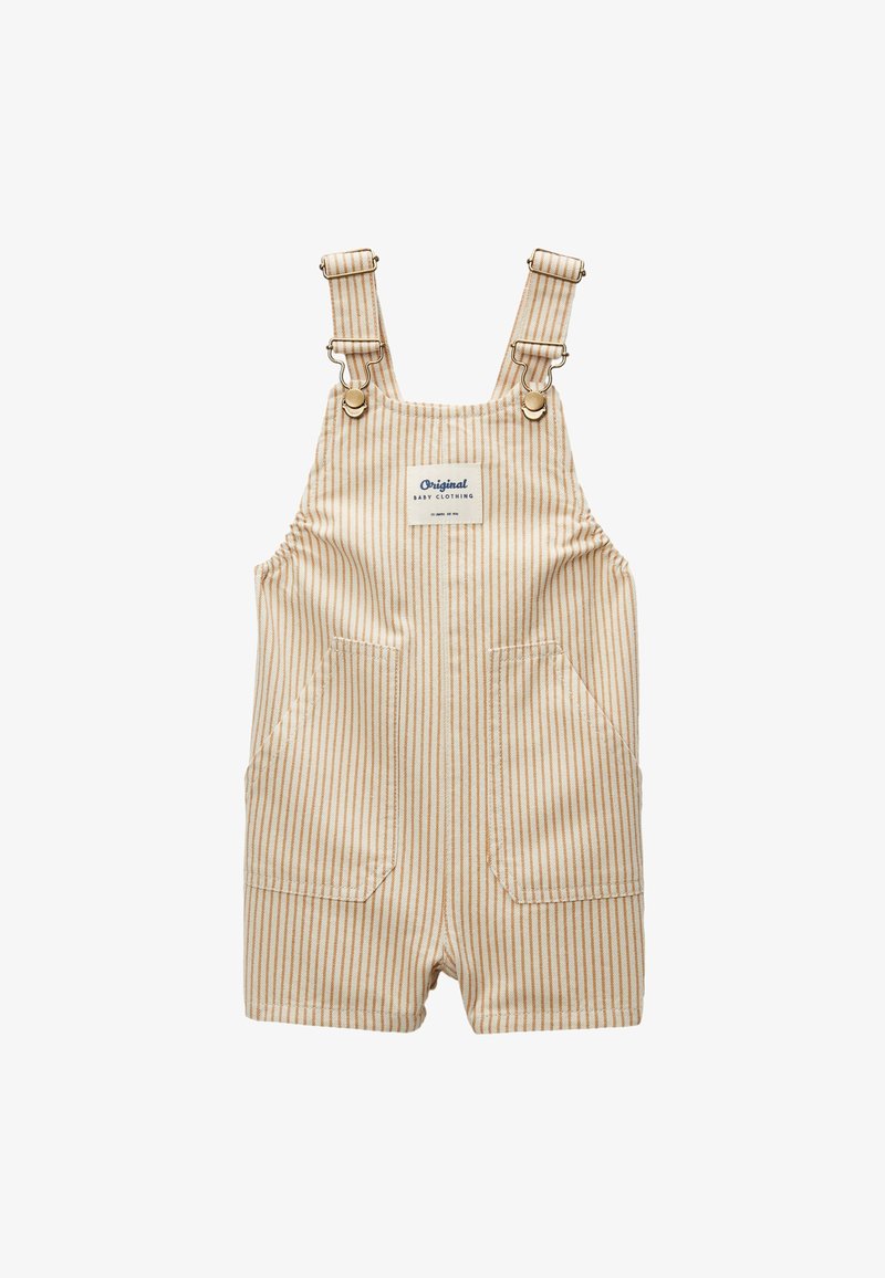 Salopette courte pour bébé à rayures verticales beige et blanche avec poches avant et bretelles réglables avec fermoirs métalliques et une étiquette « Original Baby Clothing ».