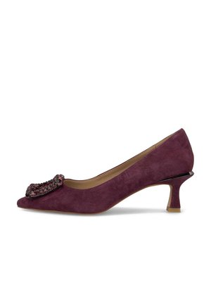 Purple suede pump with a pointed toe, embellished with a beaded detail on the front, and a short, sculpted heel. Smooth inner lining.