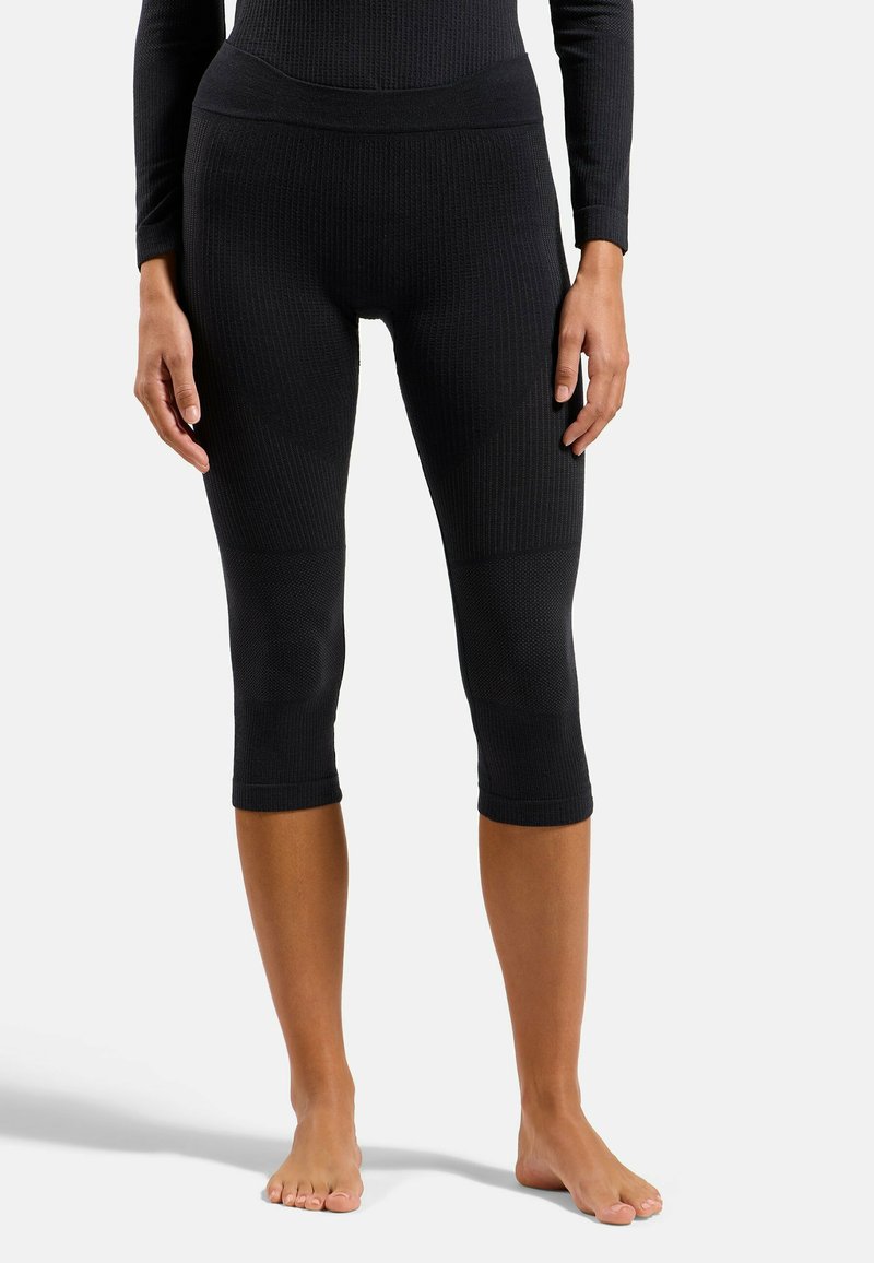 Schwarze Rippleggings mit hoher Taille, verkürzter Länge und strukturiertem Stoffdetail. Verfügt über ein glattes, enganliegendes Design.