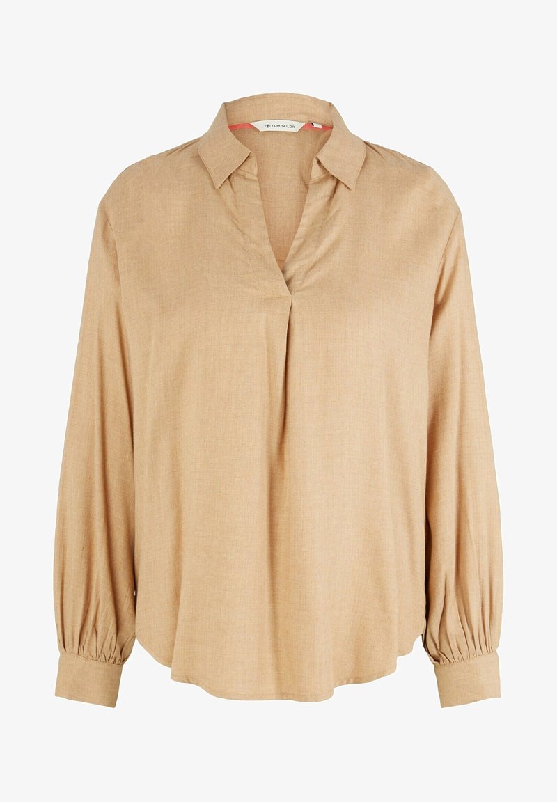 Blouse beige à manches longues avec col, ouverture en V, poignets froncés et coupe ample.