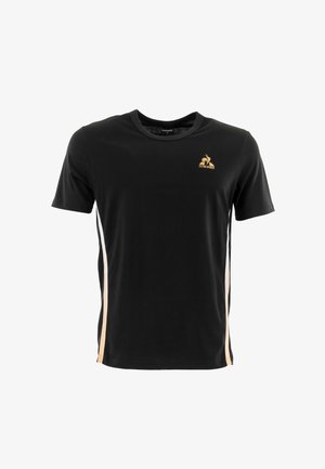 T-shirt in cotone nero con colletto rotondo, maniche corte e strisce laterali beige. Logo dorato sul petto. Texture morbida.