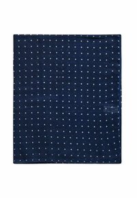 Navyblå tygkvadrat med vita prickar, med en slät yta och fina kanter, mäter ungefär 1 meter i bredd.