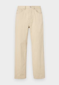 Beige cotton straight-leg jeans with a button closure, five pockets, and subtle stitching. Smooth texture and minimal detailing.