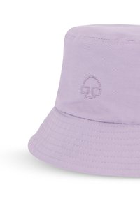 Fialová bucket hat vyrobená z mäkkej tkaniny, s vyšitou logom usmiatej tváre a širokým, štruktúrovaným okrajom s horizontálnymi švami.