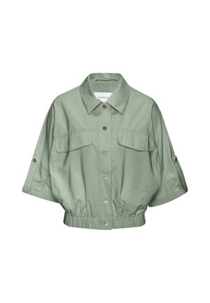 Light green cropped jacket with short sleeves, button front, two chest pockets, elastic waistband, and a collar.
