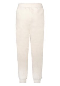 Teplákové kalhoty z fleecu ve světlé krémové barvě s elastickým pasem a manžetami na kotnících, vyznačující se měkkou, texturovanou tkaninou.