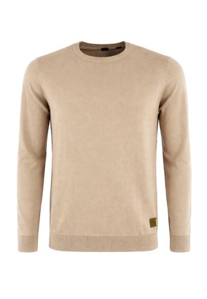 Maglione beige a maniche lunghe con collo rotondo, polsini e orlo a coste, con una piccola toppa del logo marrone vicino all'orlo inferiore.
