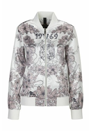 Giacca bomber bianca con grafiche floreali e di leoni in tonalità pastello. Presenta una chiusura a zip, polsini a costine e colletto alto.