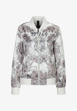 Bílá bomber bunda s květinovými a lvími grafikami v pastelových odstínech. Má zipový přední díl, žebrované manžety a vysoký límec.