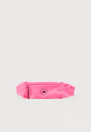 Bright pink waist bag with zipped front pocket and black circular logo reading "STELL MCARTNEY" around a triangle symbol.