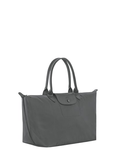 Large gray tote bag with dual handles, zip closure, and a front flap with snap button detail.