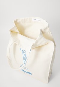 Cream-colored canvas tote bag with blue ice cream cone graphic and "PLEASE" text. Features sturdy handles and an open top design.