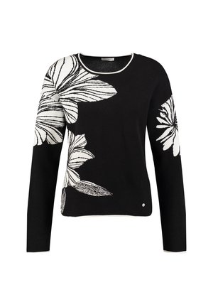 Schwarzer Pullover mit langen Ärmeln, der weiße Blumenmuster aufweist. Rundhalsausschnitt mit einem kontrastierenden weißen Saum am Halsausschnitt und am Saum.