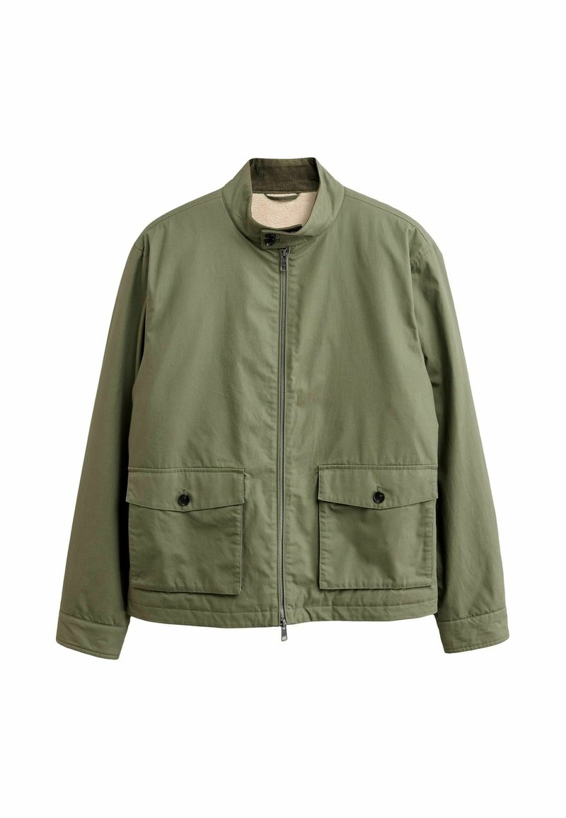 Olive green jacket with a high collar, front zipper, and two large flap pockets. Made of smooth, lightweight fabric.