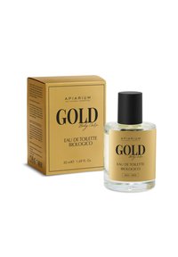 Bottiglia di vetro trasparente con tappo nero, etichetta dorata e nera, confezione in scatola dorata con testo. 50 ml di Eau de Toilette, biologica.