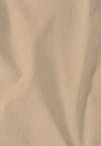 Beige fabric with fine diagonal ribbed texture, showing soft folds and subtle shading.