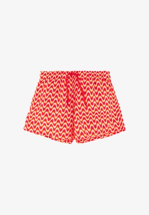 Bañador con patrón de zigzag en rojo, amarillo y blanco, con cintura elástica y cordón rojo.