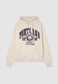 Felpa crema con tasca frontale, cappuccio regolabile con lacci, e una grafica che presenta un orso e il testo: "PORTLAND 1988 STATI UNITI USA Oregon."