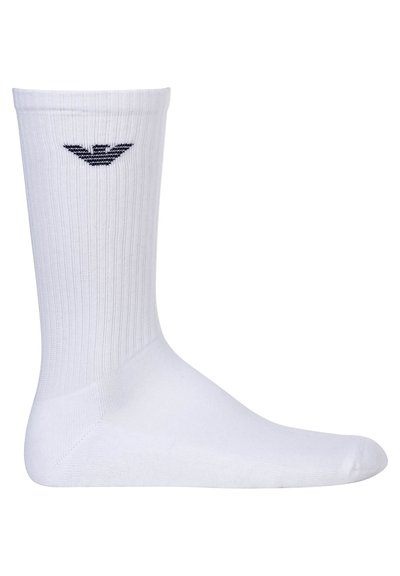 Calza di cotone bianca con texture a coste, caratterizzata da un logo blu vicino alla parte superiore. La calza ha una lunghezza standard e una cucitura della punta liscia.