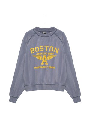 Sweat-shirt gris à manches longues avec texte jaune "Boston Athletic Dept University Team" et graphique de la lettre A ailée sur le devant.