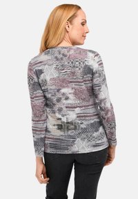 Langsl sleeve shirt in een gestructureerd, multikleurig patroon van grijs, paars en crèmekleurig, met een ronde halslijn en zachte stof.