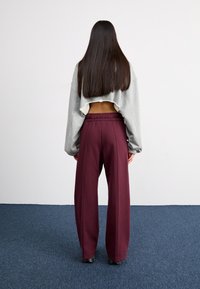Nike Sportswear PANT - Treningo apatinė dalis - burgundy crush/bright crimson/dark pony