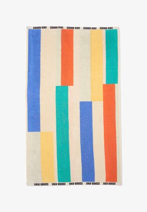 Meerling gekleurde handdoek met verticale blauwe, oranje, groene en gele strepen op een crèmekleurige achtergrond, "Bobo Choses" tekst op de randen.