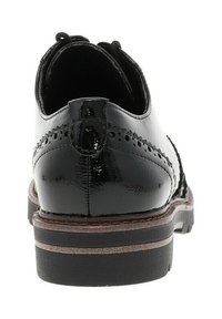 Black patent leather dress shoe with brogue detailing, textured finish, and a sturdy rubber sole. Back view shows a small pull tab.