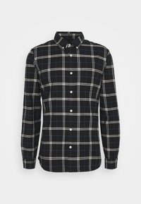 Zwart-wit geruit overhemd met blauwe accenten, met knoopsluiting op de kraag, lange mouwen en een knopenlijst aan de voorkant. Gemaakt van geweven stof.