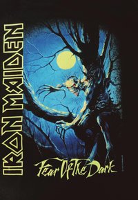 Black t-shirt featuring a colorful graphic of a monstrous figure on a tree, against a blue night sky with a full yellow moon. Text reads "Iron Maiden" and "Fear of the Dark."