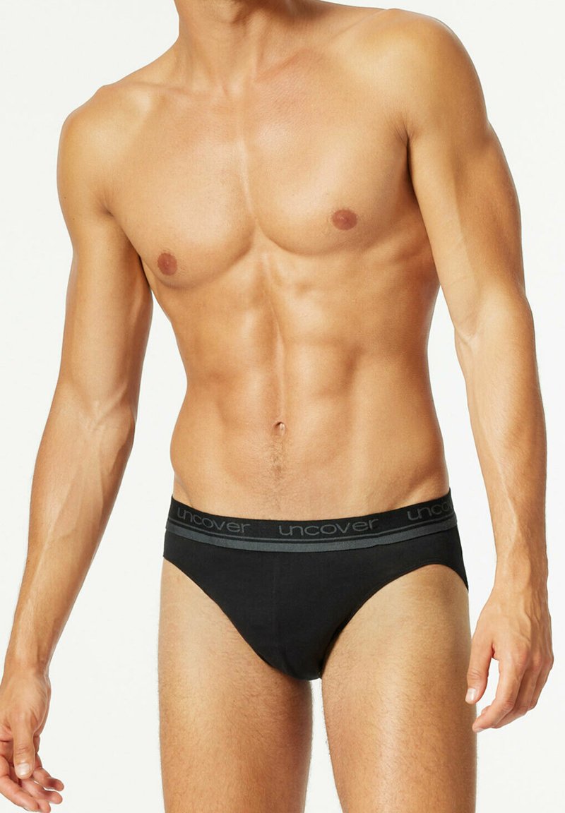 Black cotton briefs with a gray branded waistband. The design is fitted, featuring a smooth texture and a classic brief cut.