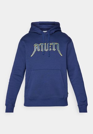 Marineblå hettegenser laget av myk stoff, med et stort gult logo "ATLET" på forsiden, justerbar snøring og frontlommesnitt.