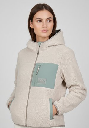 Beige Fleecejacke mit Kapuze, ausgestattet mit einer grünen, mit Reißverschluss versehenen Brusttasche, glatten Reißverschlüssen und strukturiertem Stoff. Standard-Schnitt mit Seitentaschen.