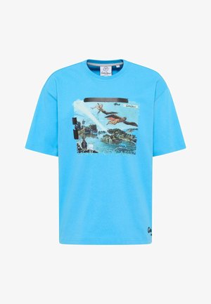 Bright blue t-shirt with a graphic of flying figures with wings over a landscape and the text "LEGACY OF ICARUS."