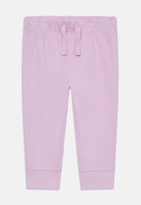 Helllila Leggings aus weichem Baumwollmaterial, mit einem elastischen Bund und einer Kordelzug, sowie enganliegenden Bündchen an den Knöcheln.
