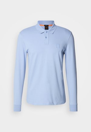 Light blue long-sleeve polo shirt made of soft fabric, featuring a two-button placket and a small logo on the chest. Accented collar.