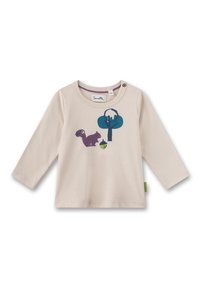 Helles beige Langarmshirt mit Rundhalsausschnitt. Mit einem bedruckten Design eines Eichhörnchens, Baums und einer Eichel in Lila und Türkis. Kleine Knopfdetails.