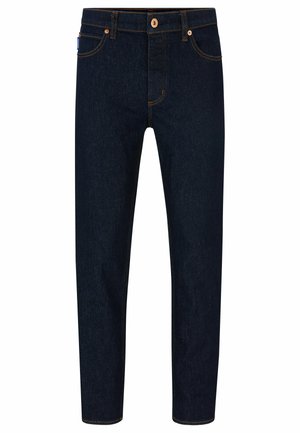 Dark blue denim jeans with a slim fit, contrasting orange stitching, and a classic button closure. Features front pockets and tapered legs.