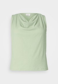 Jasnozielony bezrękawnik z dekoltem w kształcie ciepłej szalowej, wykonany z fakturowanej tkaniny z delikatnym pionowym prążkowaniem. Gładkie wykończenie i luźny krój.