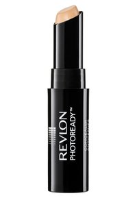 Correttore in stick Revlon PhotoReady con confezione nera e meccanismo a rotazione; include un prodotto cremoso beige chiaro nella parte superiore.