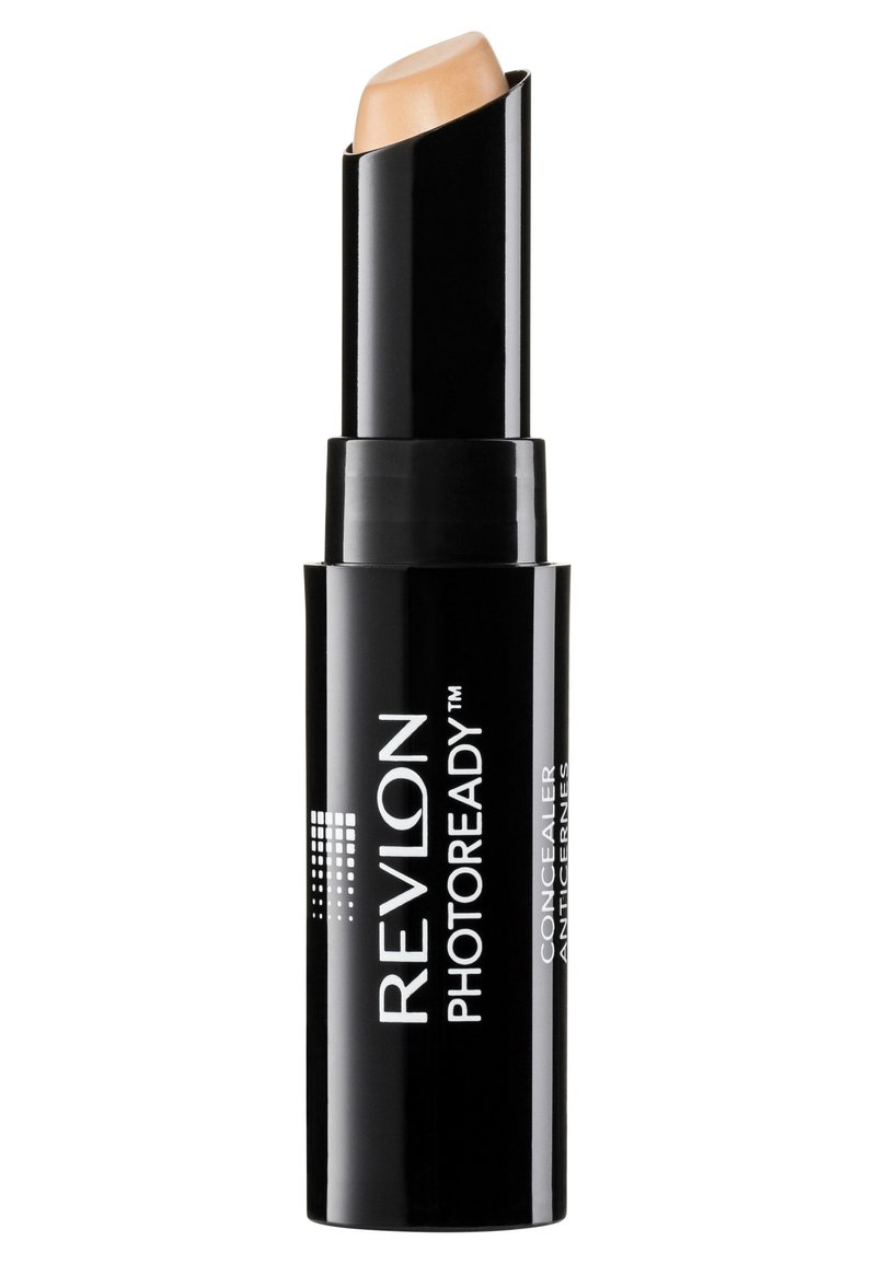 Correttore in stick Revlon PhotoReady con confezione nera e meccanismo a rotazione; include un prodotto cremoso beige chiaro nella parte superiore.