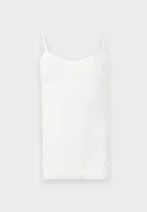 Hvit camisole med tynne justerbare stropper, ribbet tekstur og blonderkant ved utringningen og kanten. Enkel, tettsittende design.